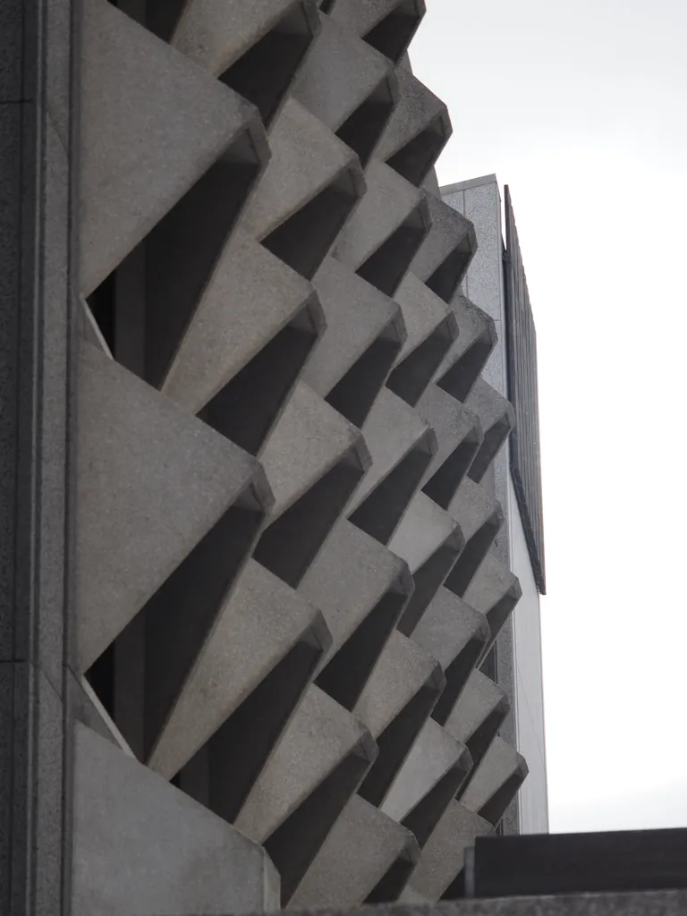 slanted concrete awnings on a large building