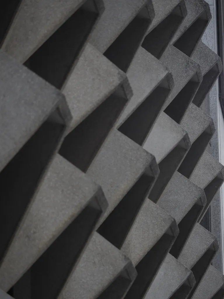 slanted concrete awnings on a large building