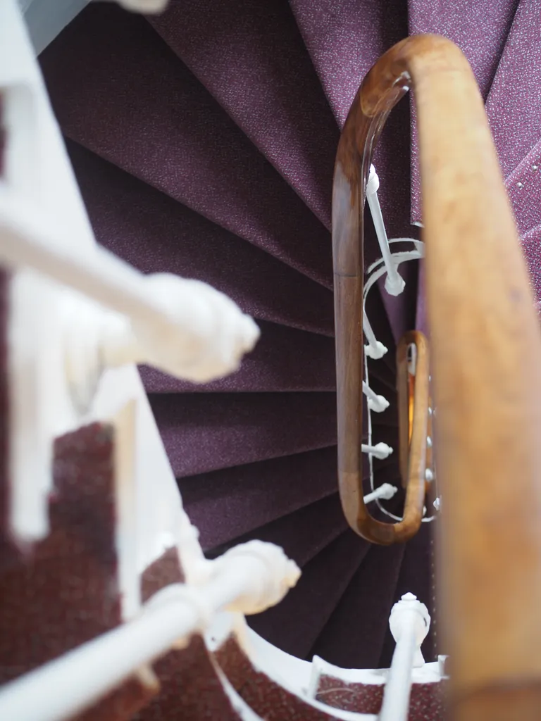 looking down a narrow spiral staircase