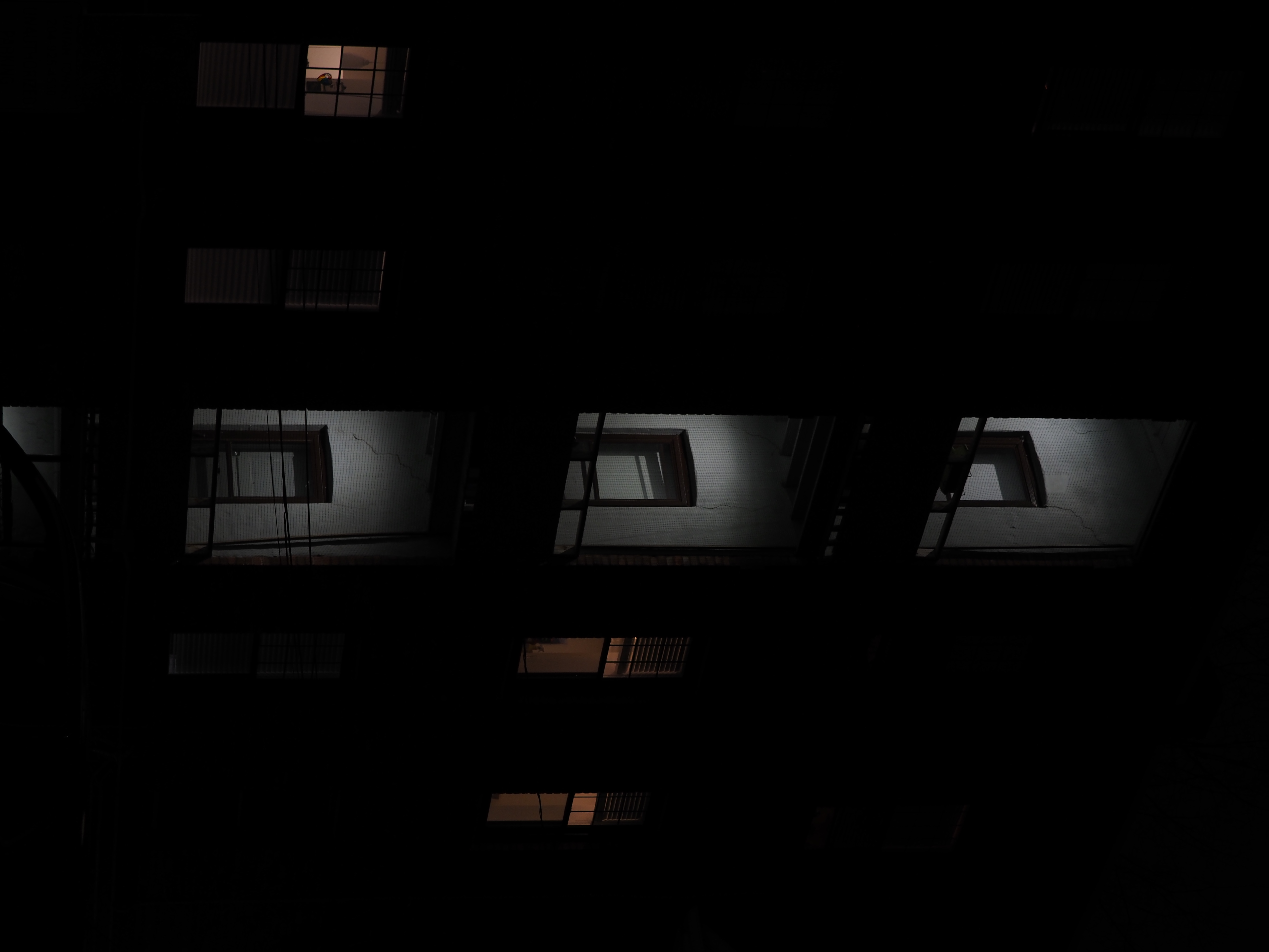 a lit multistorey entranceway to an apartment