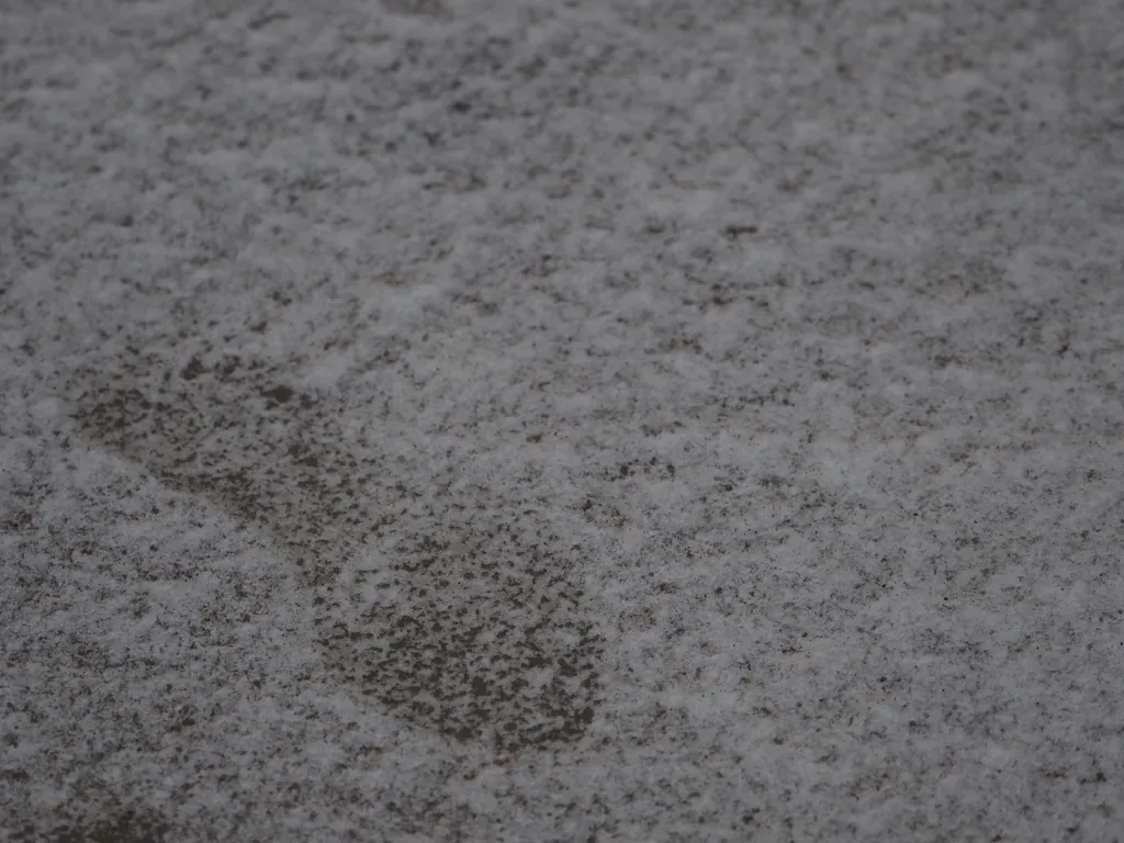 a footprint in snowy ice