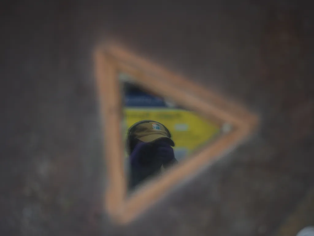 a selfie in a triangular window