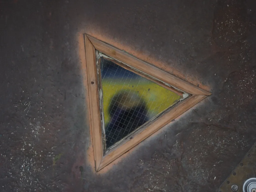 a selfie in a triangular window