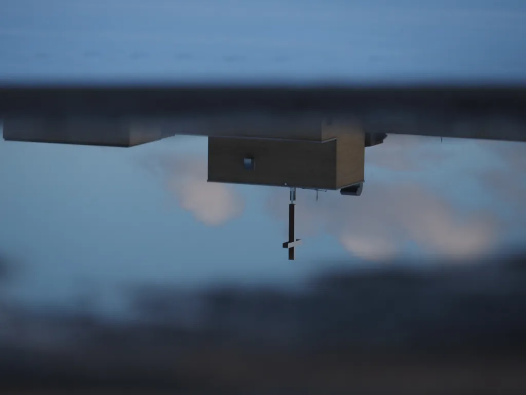 a hospital reflected in a puddle