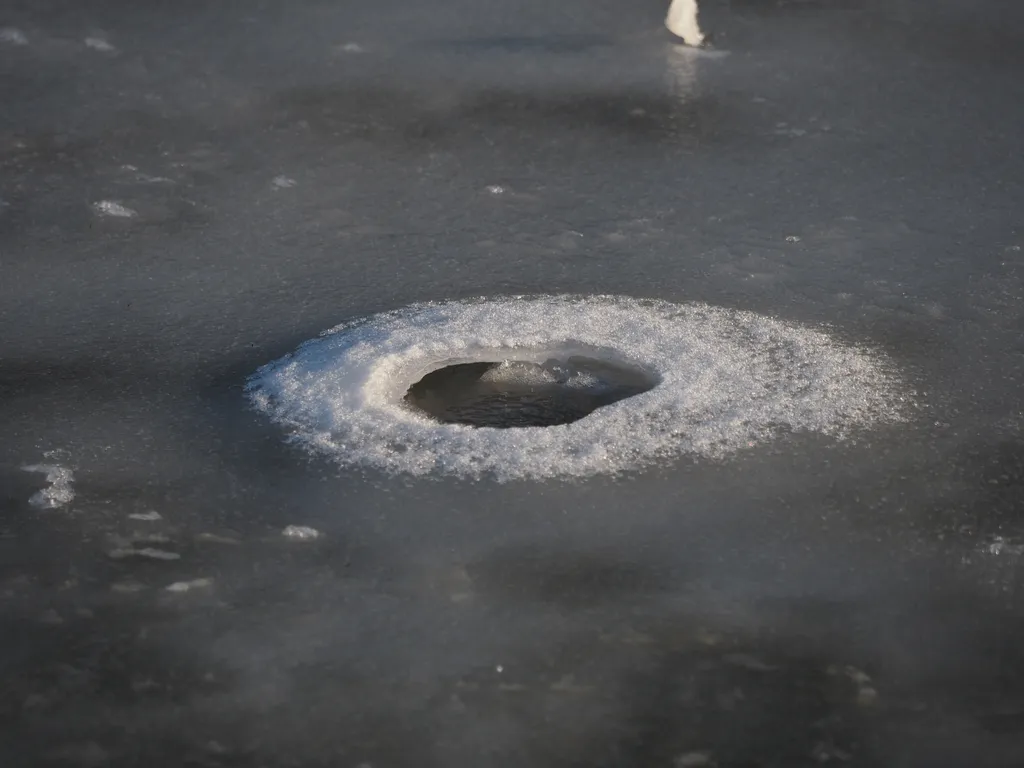 a hole in a frozen river