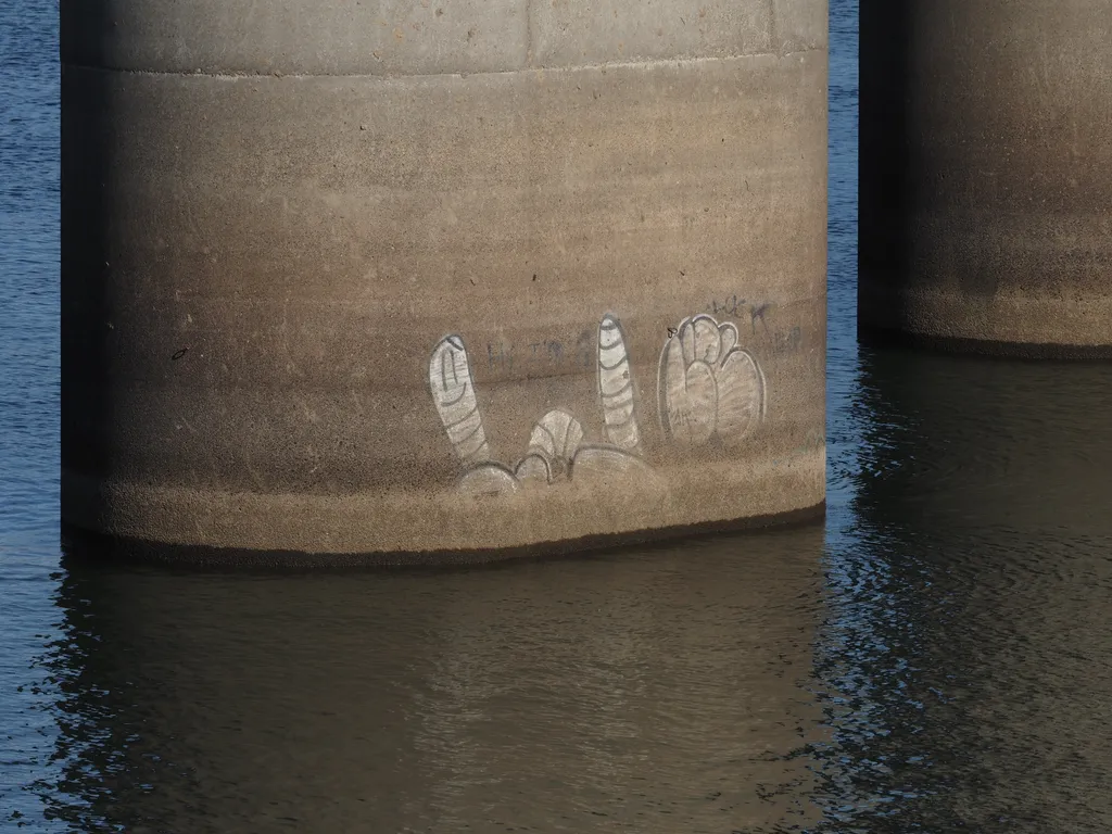 a worm drawn on the base of a bridge