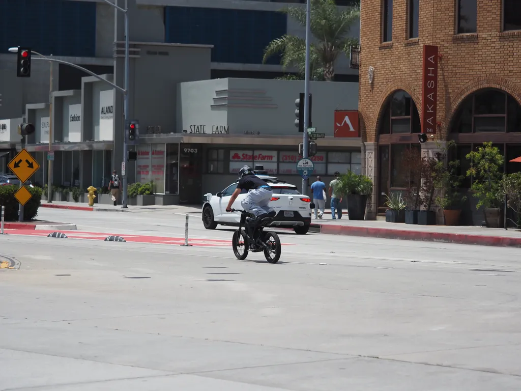 a person standing on a motorcycle