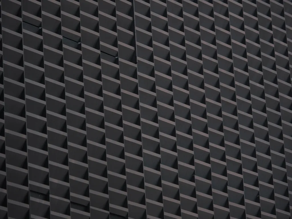 the patterned wall of a parking garage