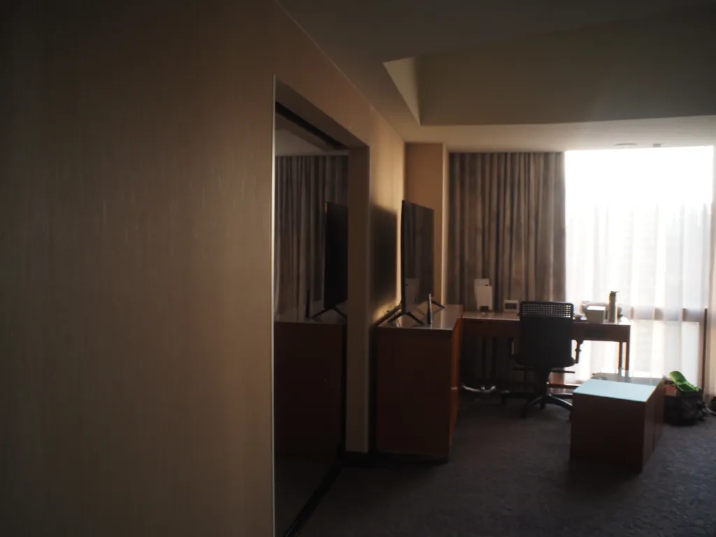 a space between rooms of a hotel suite that looks like a mirror