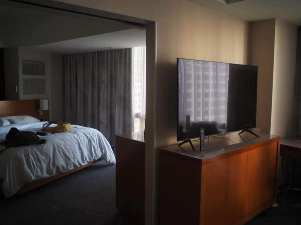 a space between rooms of a hotel suite that looks like a mirror
