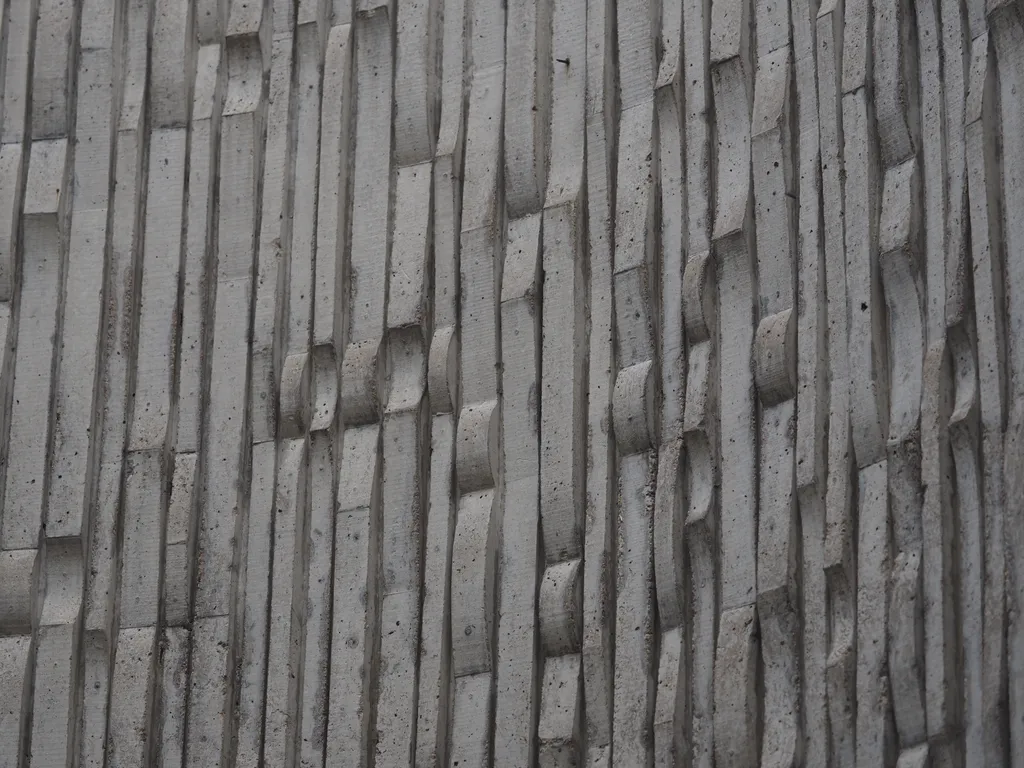 the inner surface of the wall surrounding Marien Lemay's Louis Riel statue