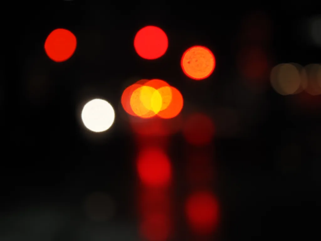 lights reflecting on a wet street