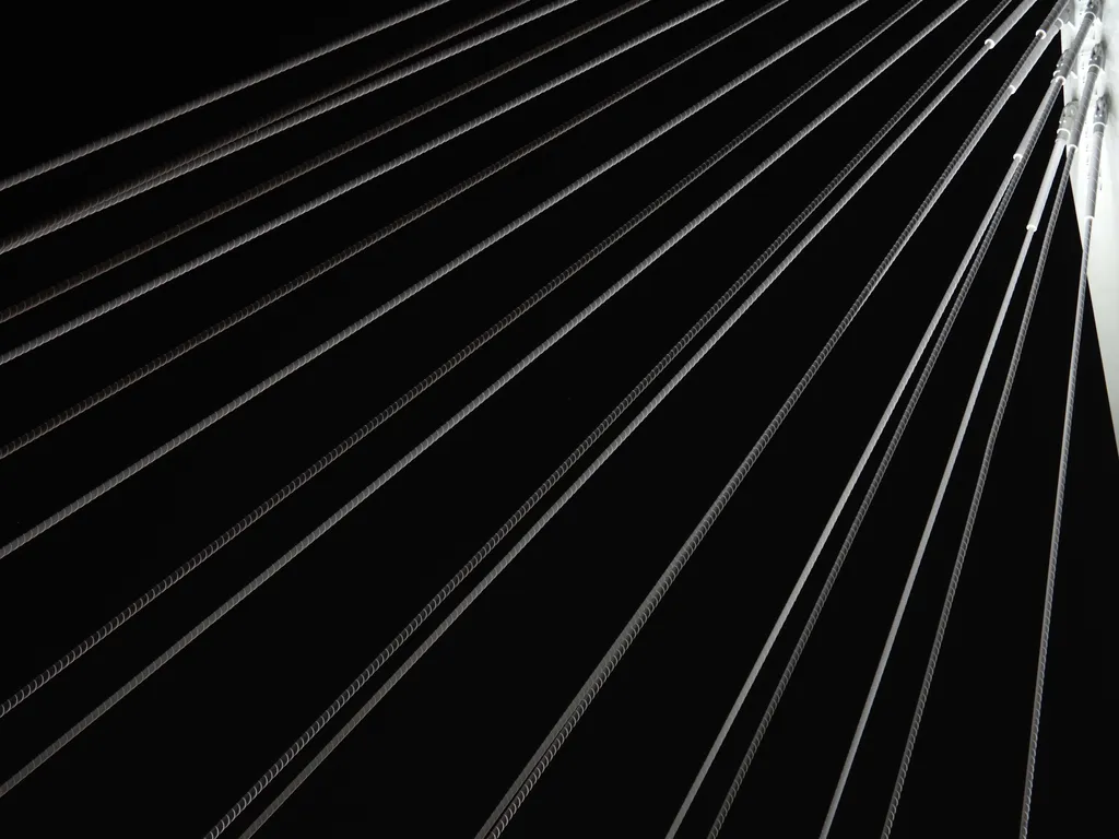 a suspension bridge at night