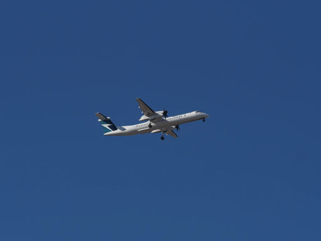 a large prop plane preparing to lande